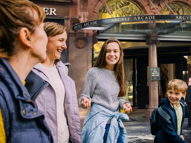 A family walking through the streets of Glasgow